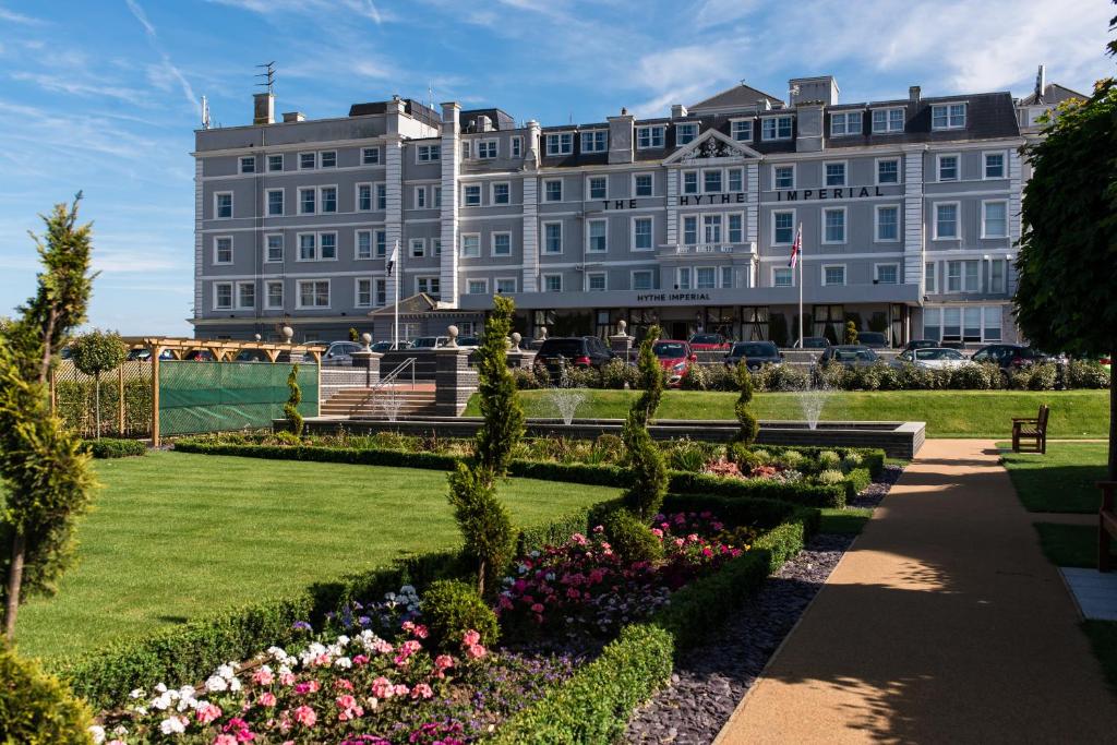 a large building with a garden in front of it at Hythe Imperial Hotel, Spa & Golf in Hythe