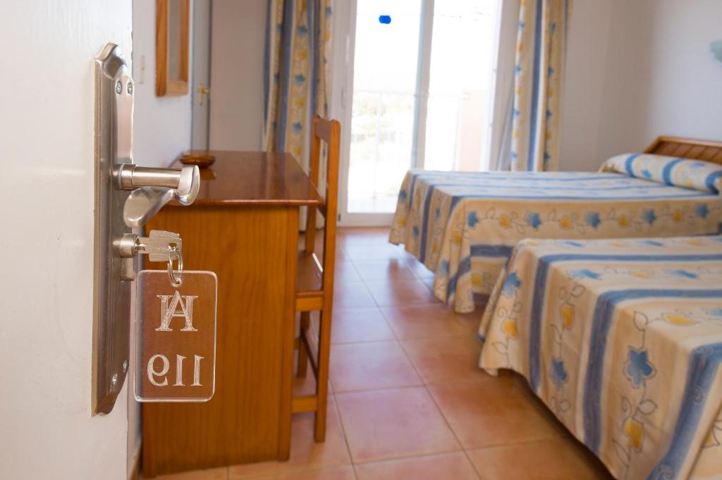 Postel nebo postele na pokoji v ubytování Hotel Anibal - AB Group