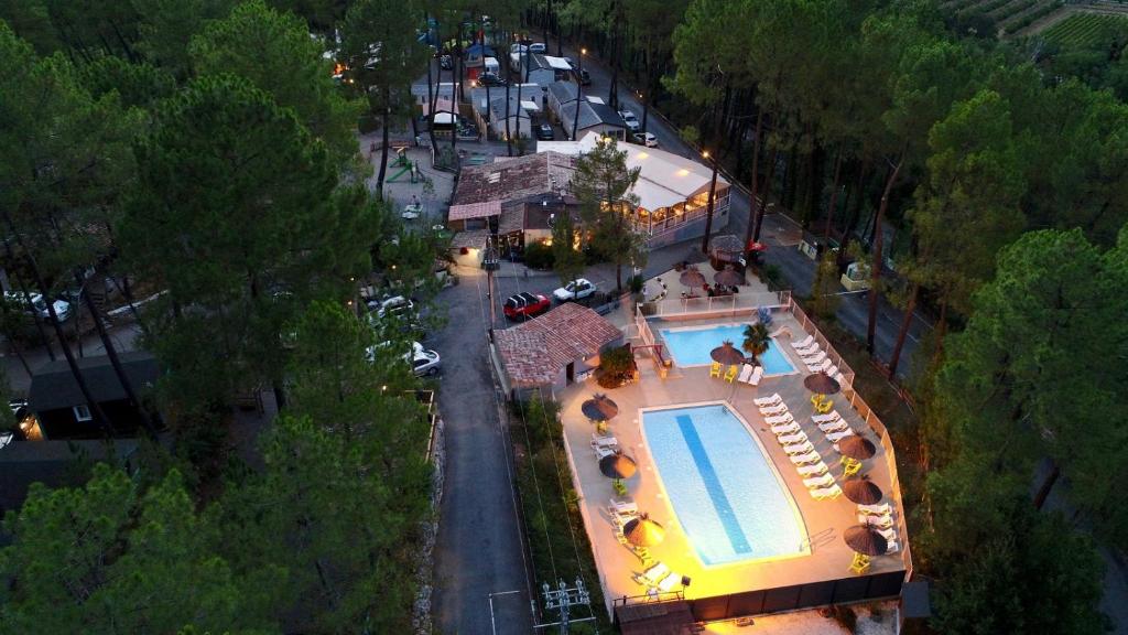an overhead view of a swimming pool at a hotel at Village de Chalets in Joyeuse