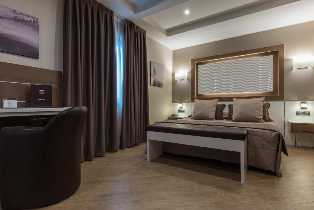 Postel nebo postele na pokoji v ubytování Magri's Hotel