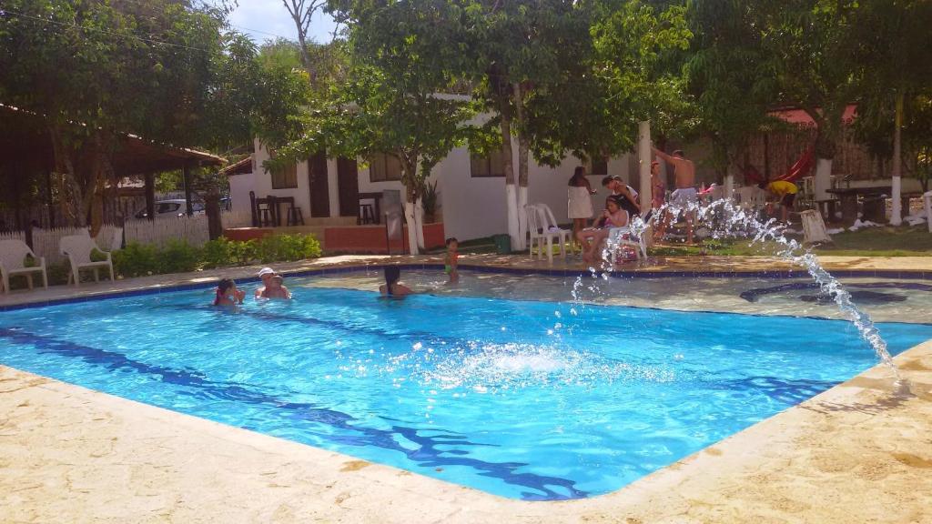 a pool of water with a swimming pool in it at Hosteria El Castellano in Santa Fe de Antioquia