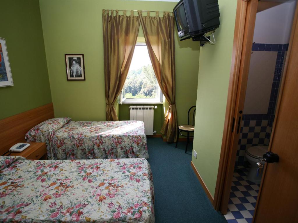 Postel nebo postele na pokoji v ubytování Hotel Sutrium