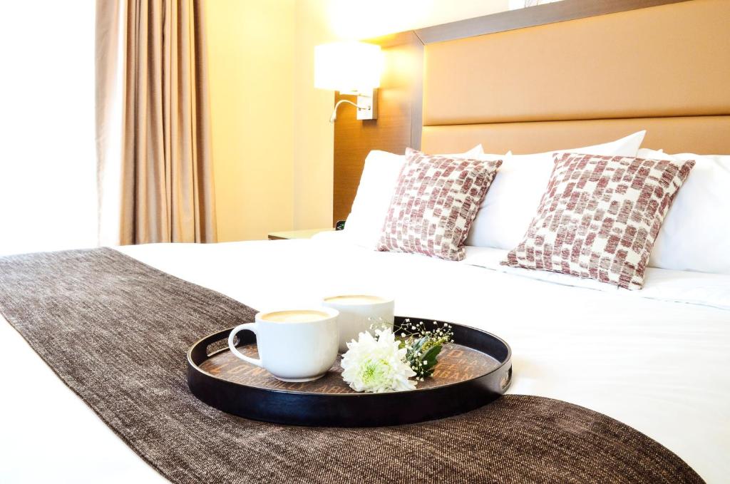 Postel nebo postele na pokoji v ubytování MStar Hotel