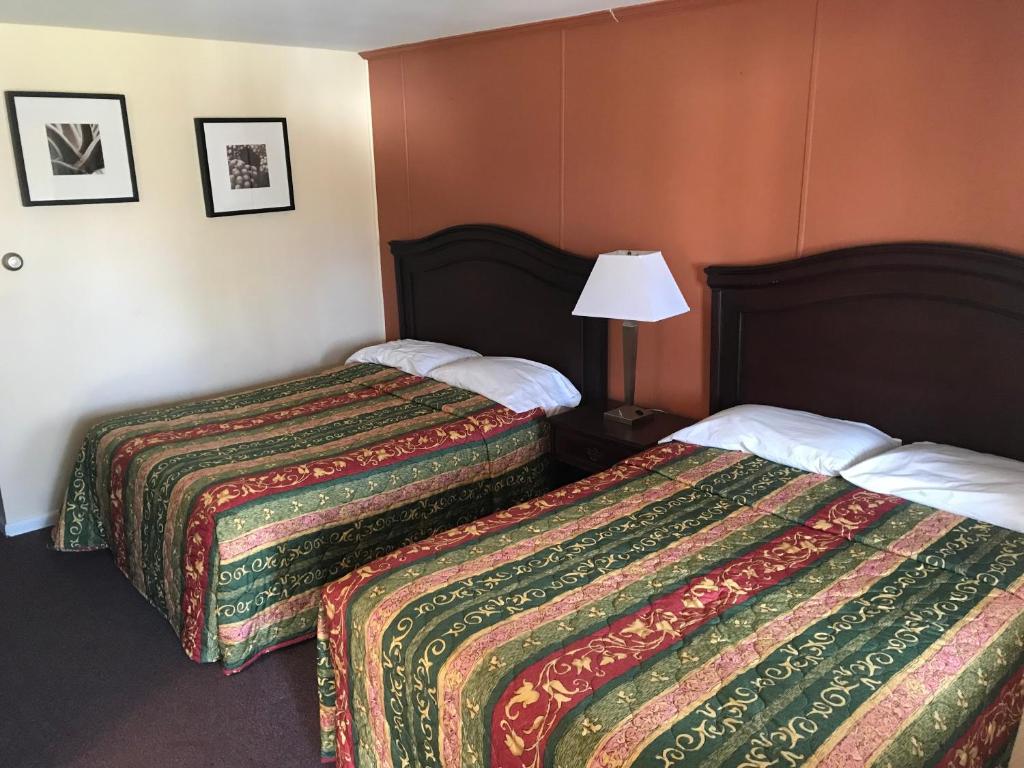 Postel nebo postele na pokoji v ubytování Angola Motel