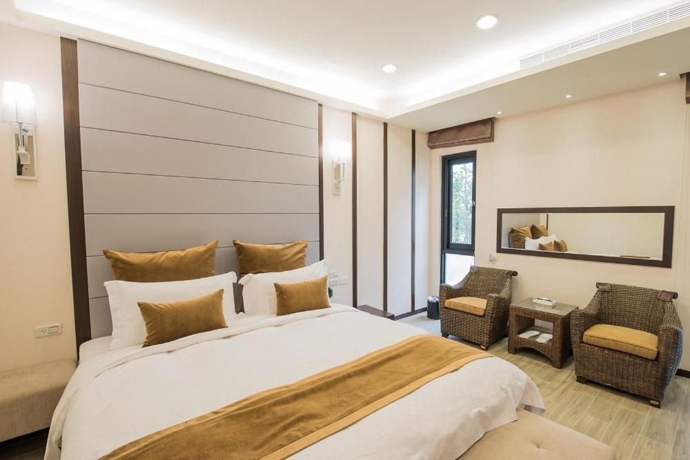 Postel nebo postele na pokoji v ubytování Shangri Longluan Lake One B&B