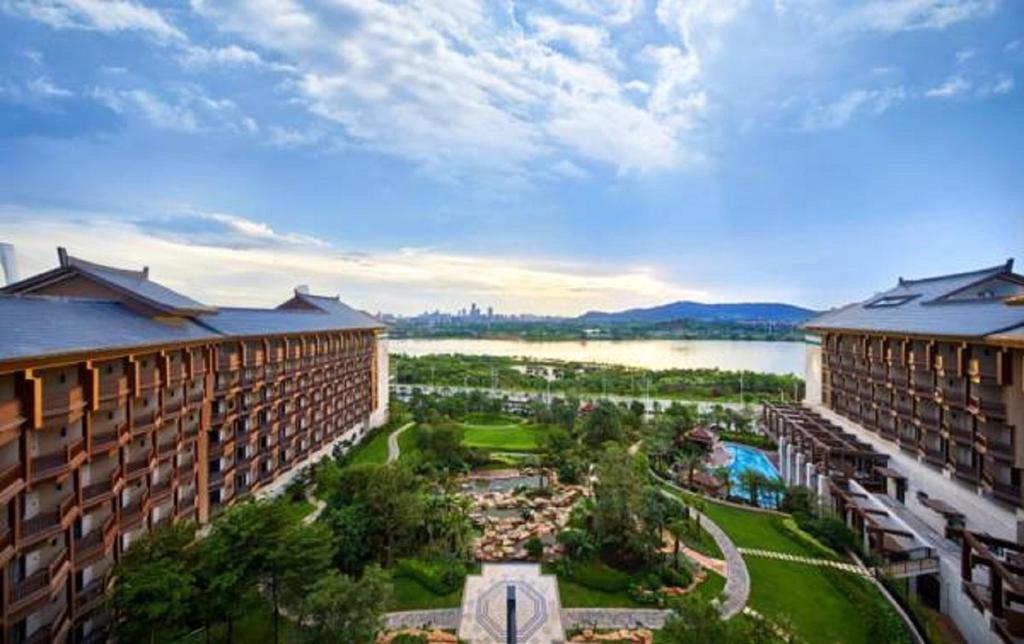 an aerial view of a resort with a body of water at Wanda Realm Resort Nanning in Nanning