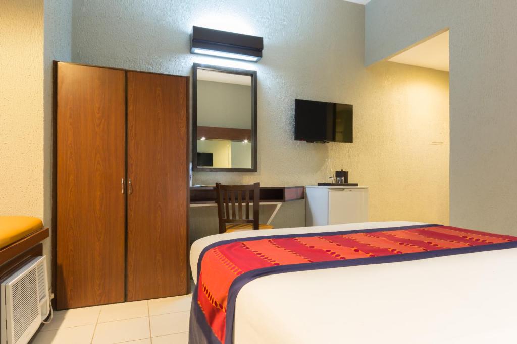 Postel nebo postele na pokoji v ubytování Microtel by Wyndham Eagle Ridge