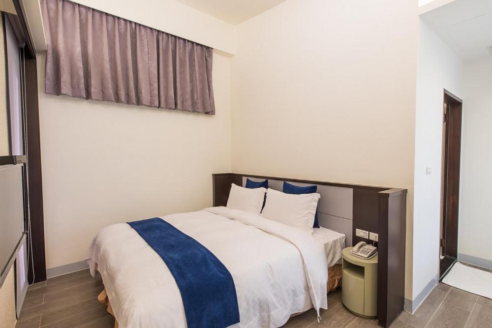 Postel nebo postele na pokoji v ubytování Shangri Longluan Lake One B&B