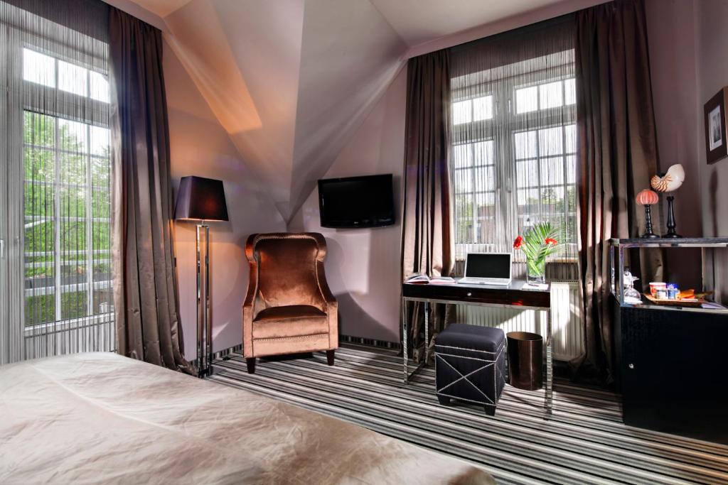 TV a/nebo společenská místnost v ubytování Boutique Hotel Poppenbütteler Hof