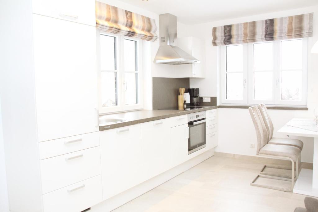 Kuchyň nebo kuchyňský kout v ubytování Apartments Fuchs