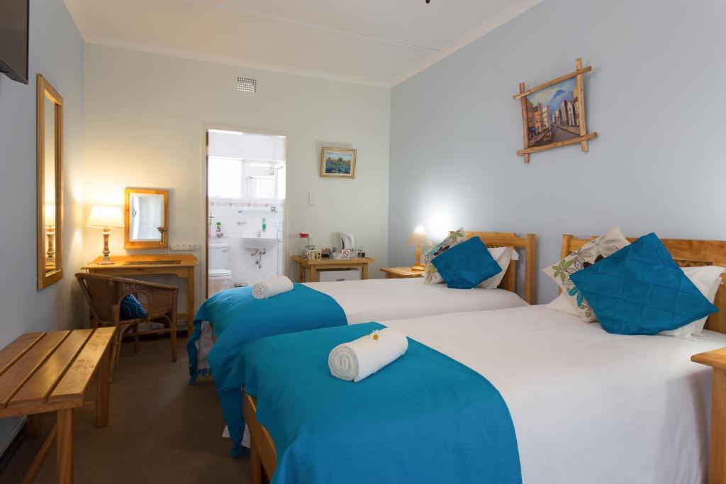 Postel nebo postele na pokoji v ubytování Colesview Guest House
