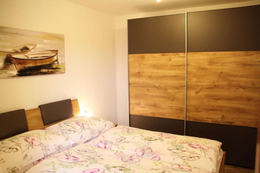 Postel nebo postele na pokoji v ubytování Apartments Fuchs