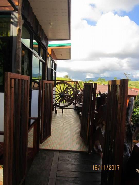 a view from the inside of a building with a wagon at Maan Mork Khao Kho in Khao Kho
