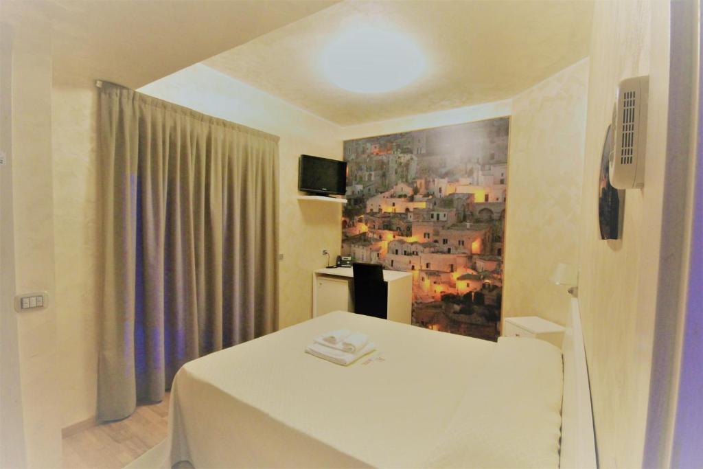 Voodi või voodid majutusasutuse I Rocchi Hotel toas