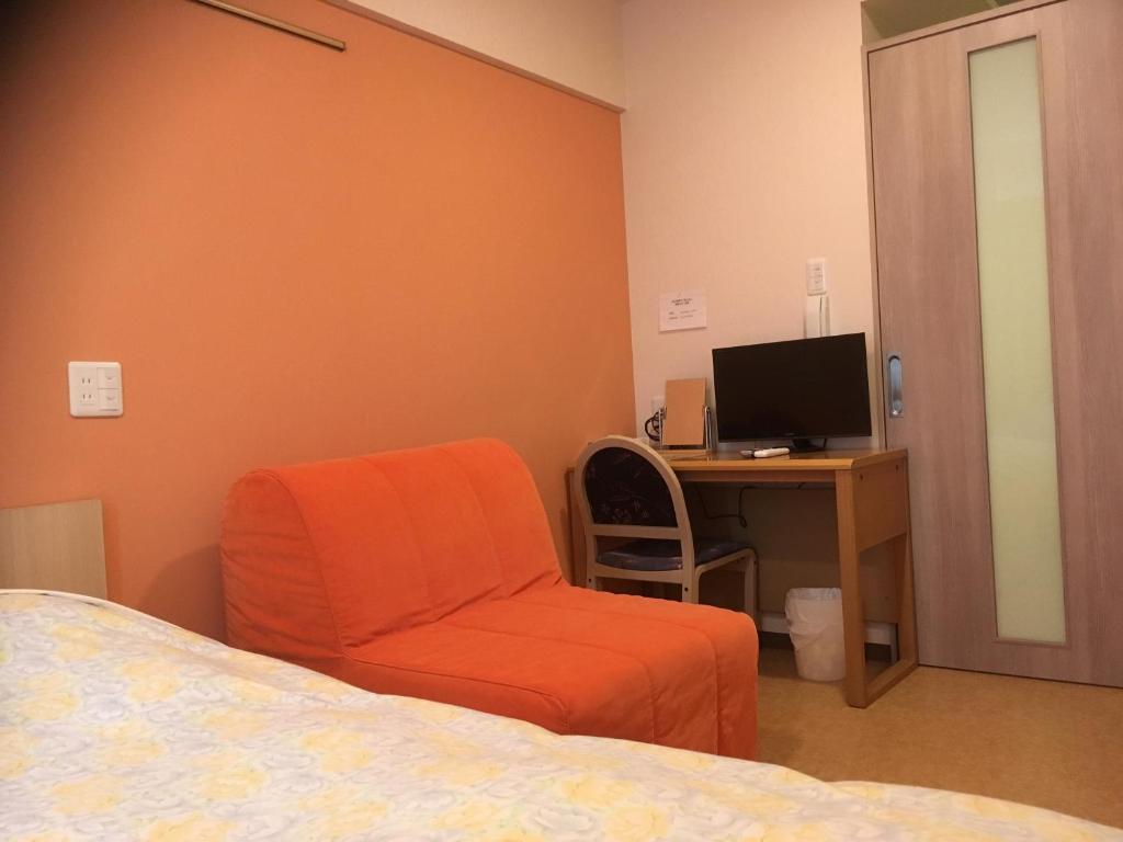 TV a/nebo společenská místnost v ubytování Hotel Asahi Grandeur Fuchu