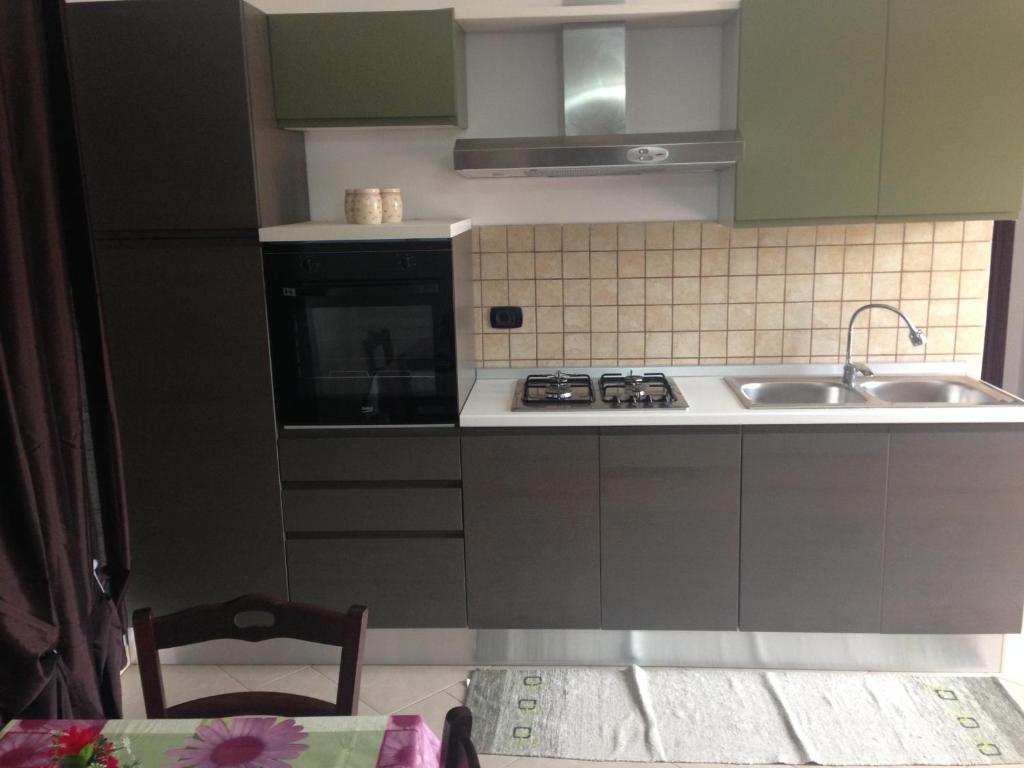 A kitchen or kitchenette at Oasi Tortuga Residence Piscina e barbecue h24