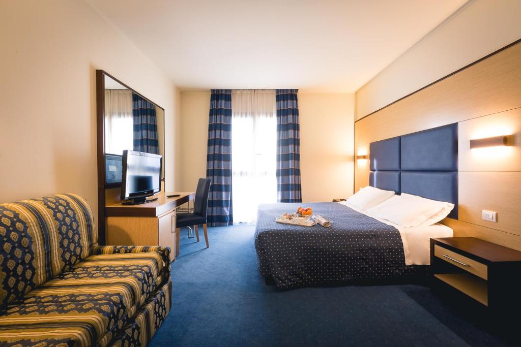 Postel nebo postele na pokoji v ubytování Inn Hotel