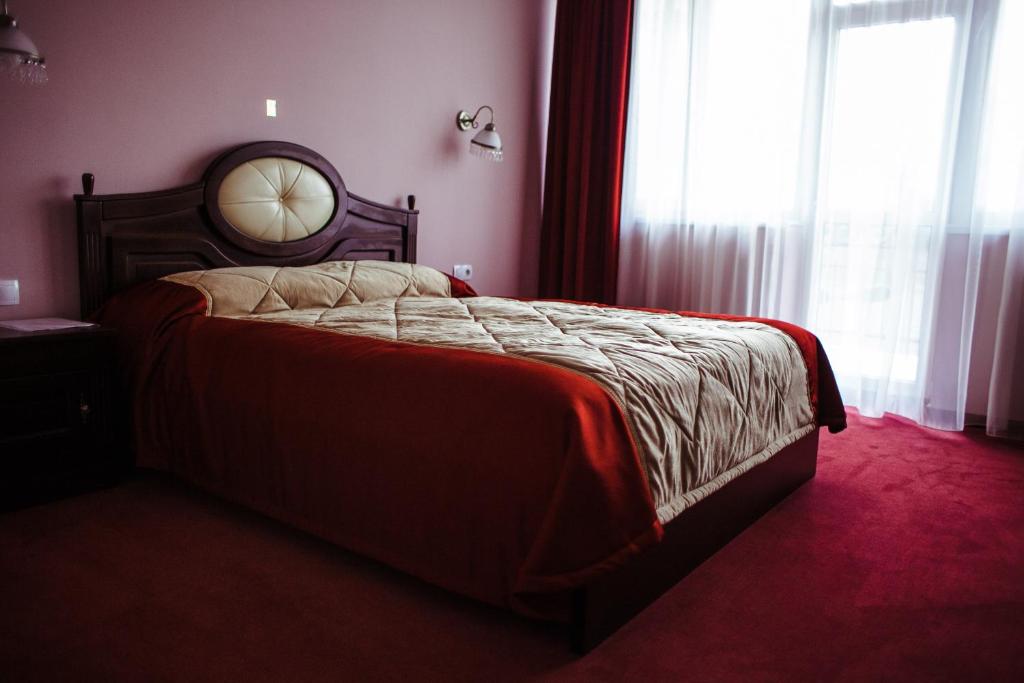 Postel nebo postele na pokoji v ubytování Warszawa Hotel