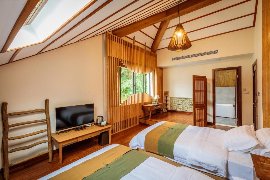Postel nebo postele na pokoji v ubytování Dan’s Sea Guest House Hangzhou