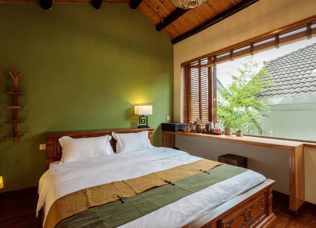 Postel nebo postele na pokoji v ubytování Dan’s Sea Guest House Hangzhou