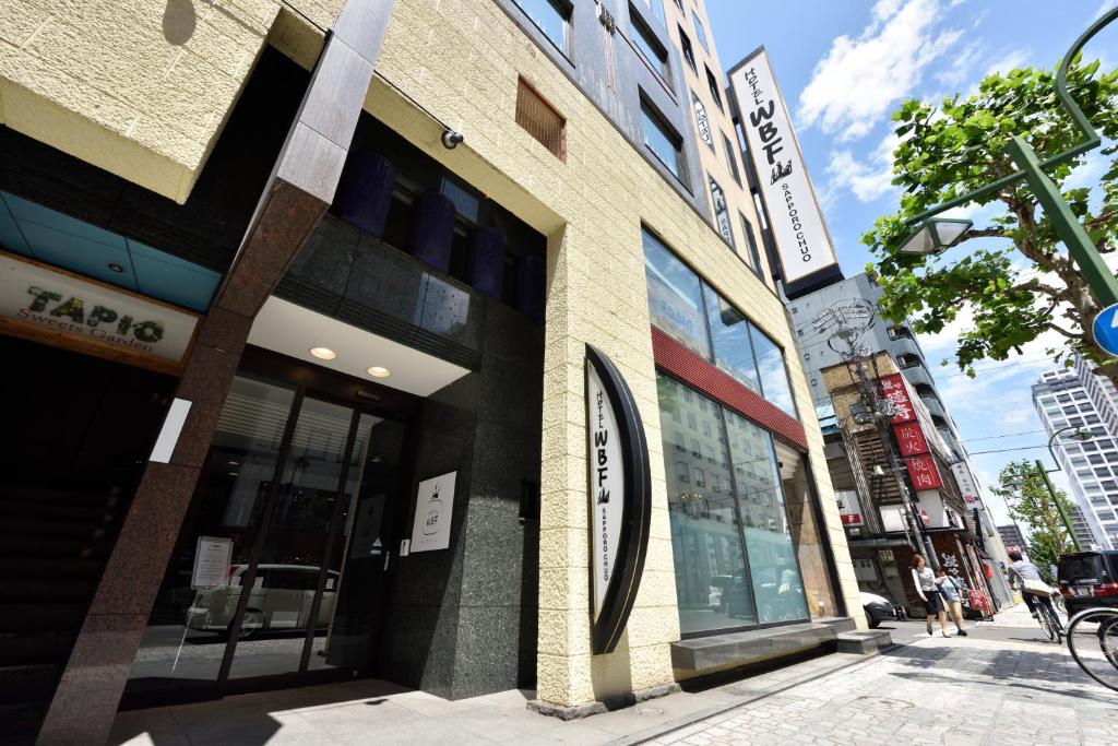 a building on the side of a city street at Hotel WBF Sapporo Chuo in Sapporo