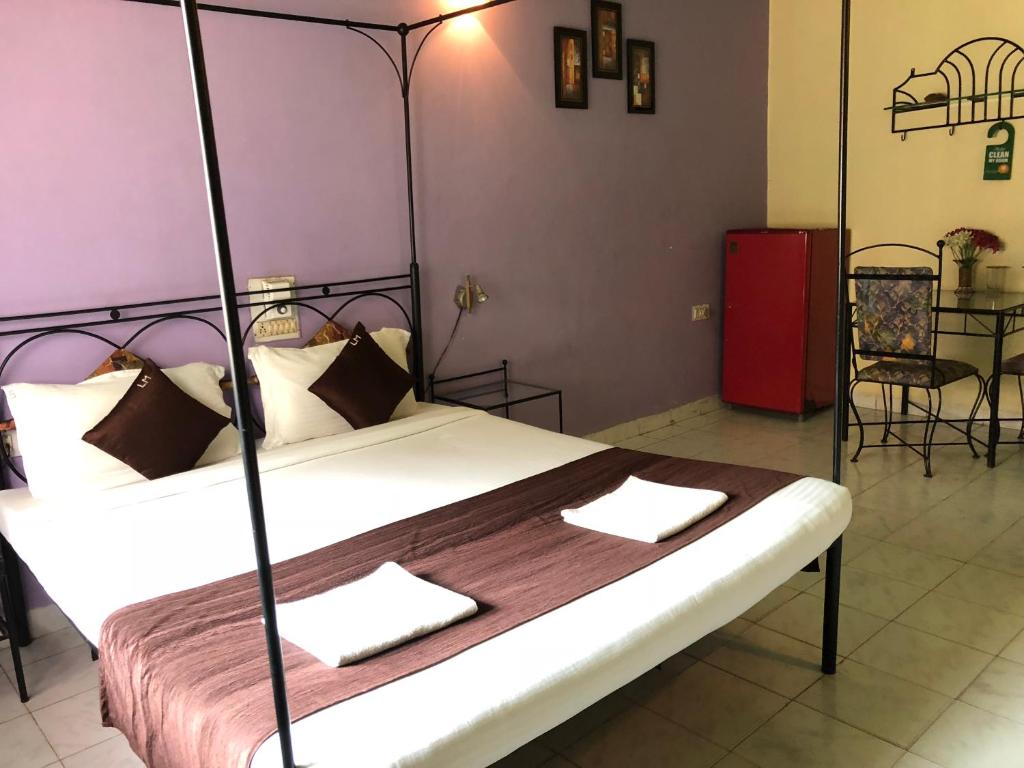 Postel nebo postele na pokoji v ubytování Libton Manor