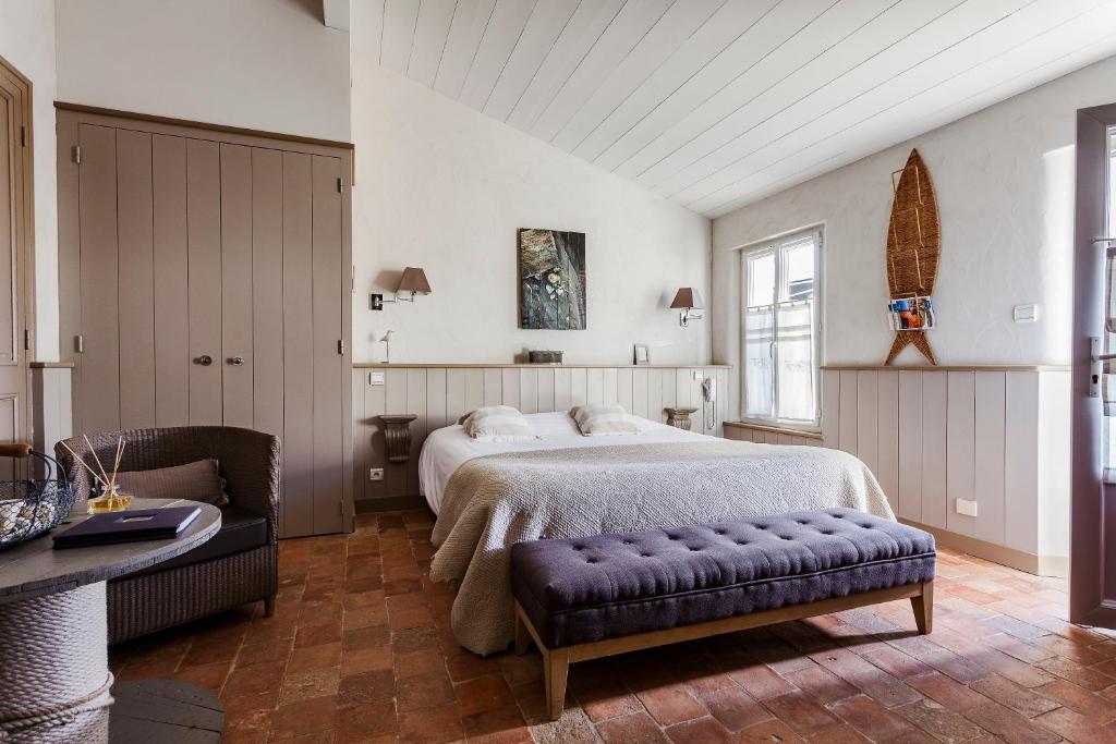 Postel nebo postele na pokoji v ubytování Hotel Les Bois Flottais