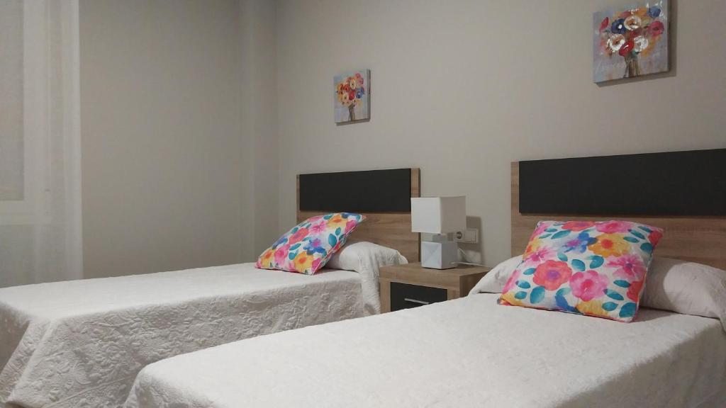 Postel nebo postele na pokoji v ubytování San Anton Centro Apartment