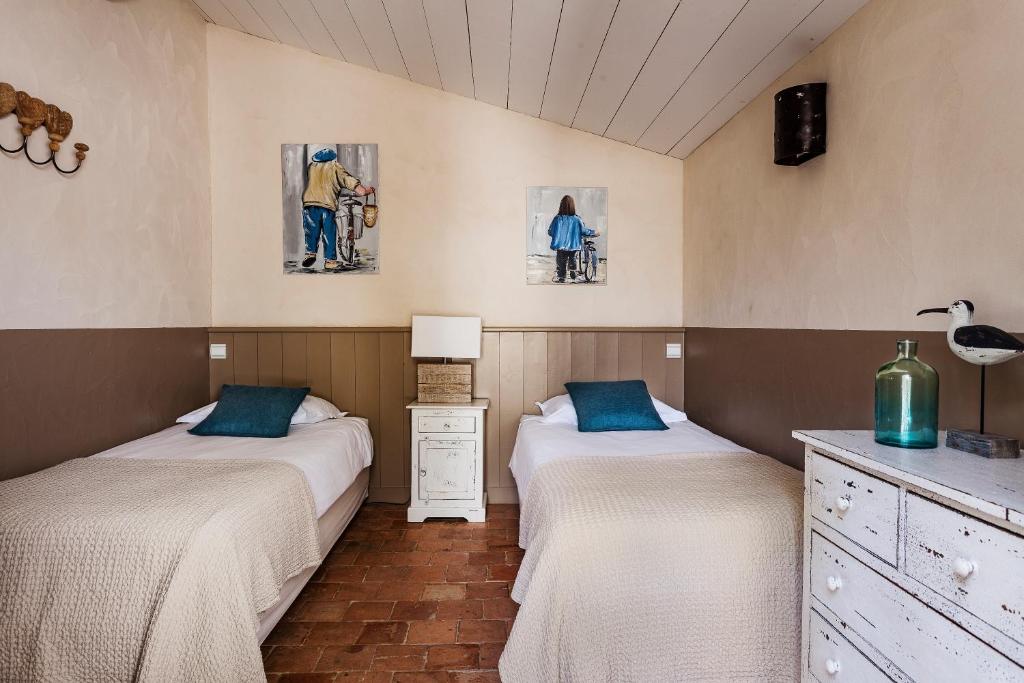 Postel nebo postele na pokoji v ubytování Hotel Les Bois Flottais