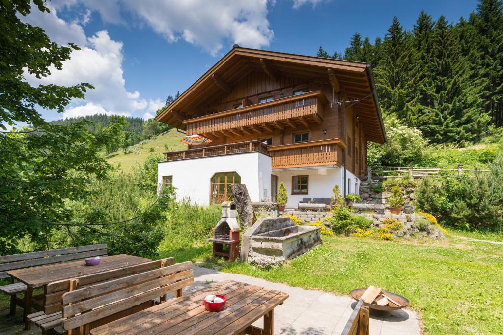 a house with a picnic table in front of it at Hacklgut in Radstadt