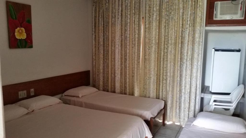 Postel nebo postele na pokoji v ubytování Quiriri Park Hotel