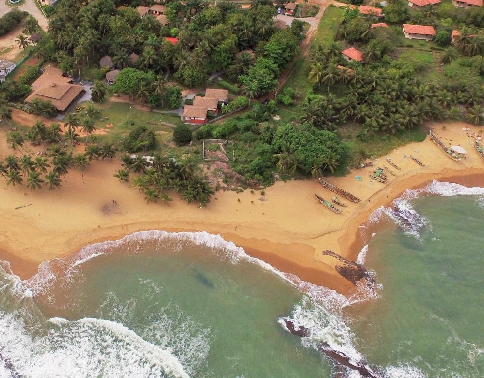 an overhead view of a beach with the ocean at Ko-Sa Beach Resort in Ampeni