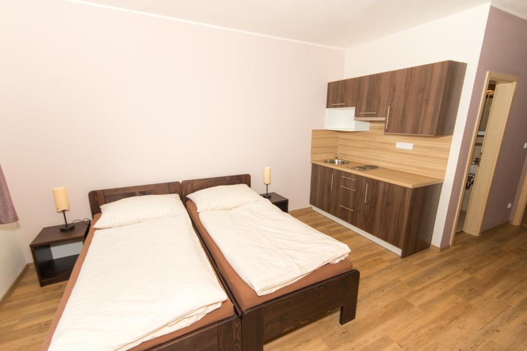 Postel nebo postele na pokoji v ubytování Penzion U Pešků