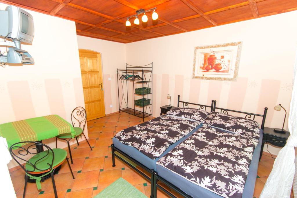 Postel nebo postele na pokoji v ubytování Penzion U Pešků