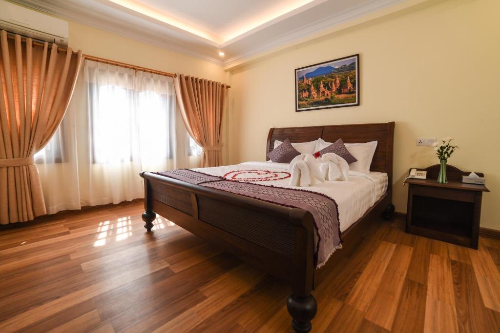 Postel nebo postele na pokoji v ubytování Bagan View Hotel