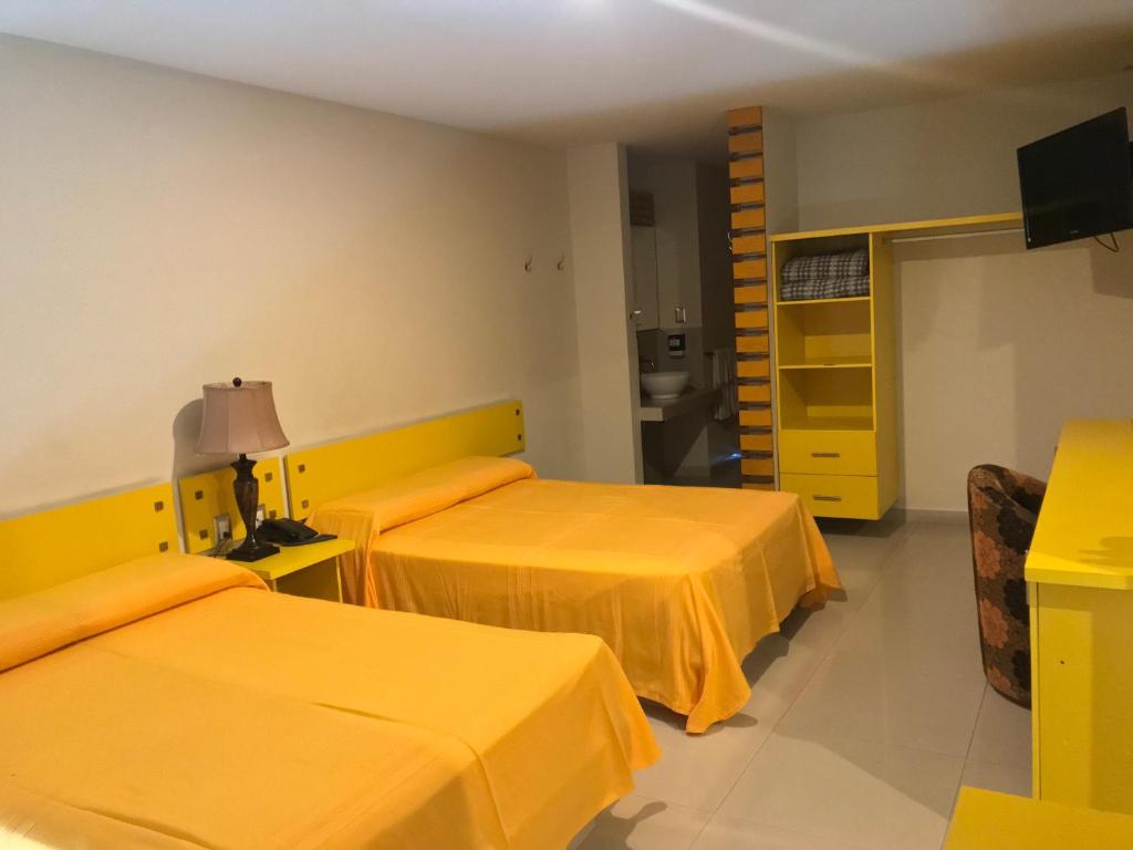 TV a/nebo společenská místnost v ubytování Palacio Rojo Hotel Familiar