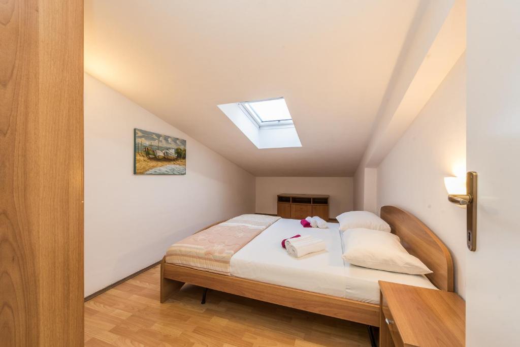 Postel nebo postele na pokoji v ubytování Villa Jurac