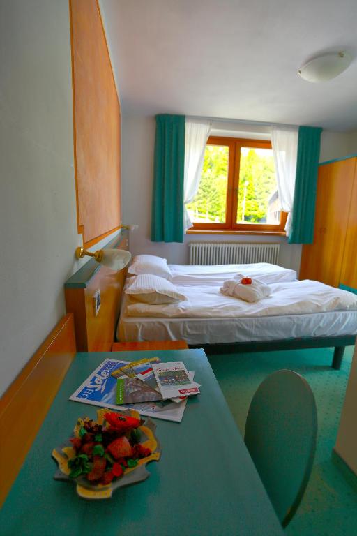 Postel nebo postele na pokoji v ubytování Hotel Fantelli