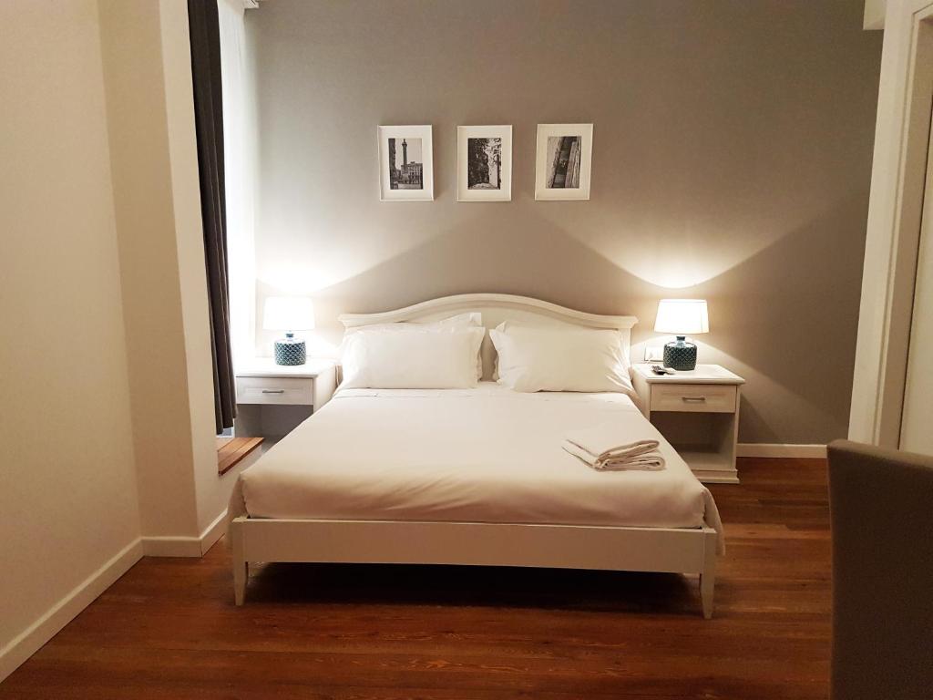 Posteľ alebo postele v izbe v ubytovaní More Cola di Rienzo B&B