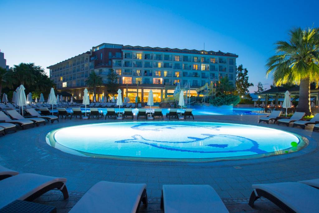 a large swimming pool in front of a hotel at Washington Resort Hotel & Spa in Kizilagac