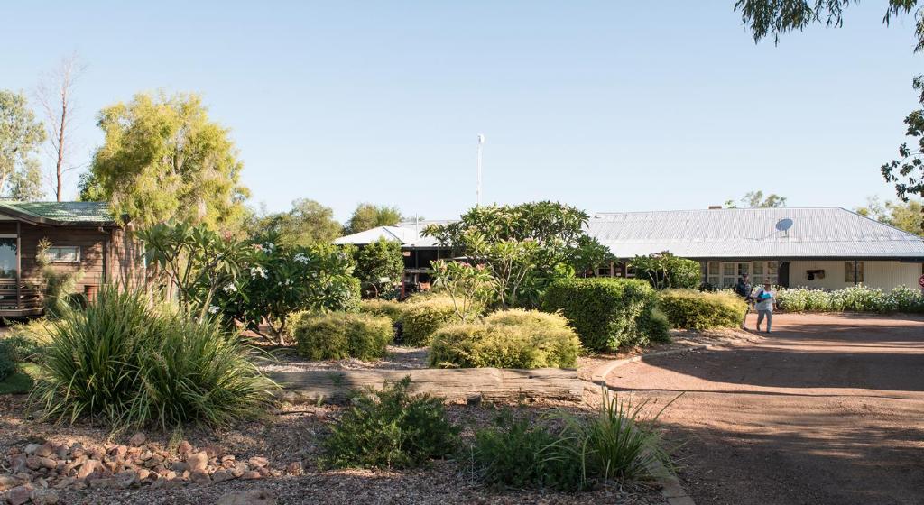 a house with a garden in front of it at Saltbush Retreat in Longreach