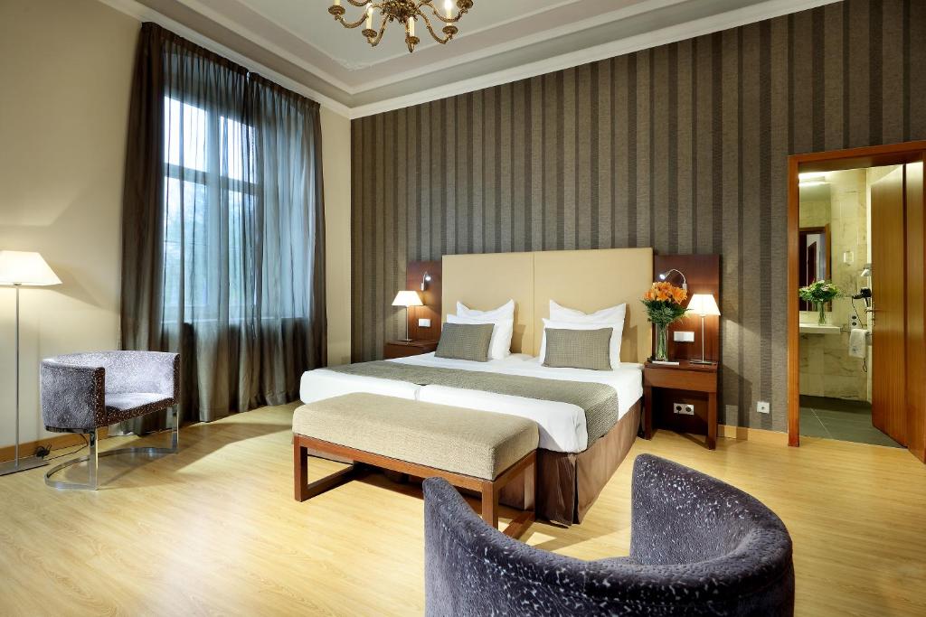 Postel nebo postele na pokoji v ubytování Eurostars Park Hotel Maximilian