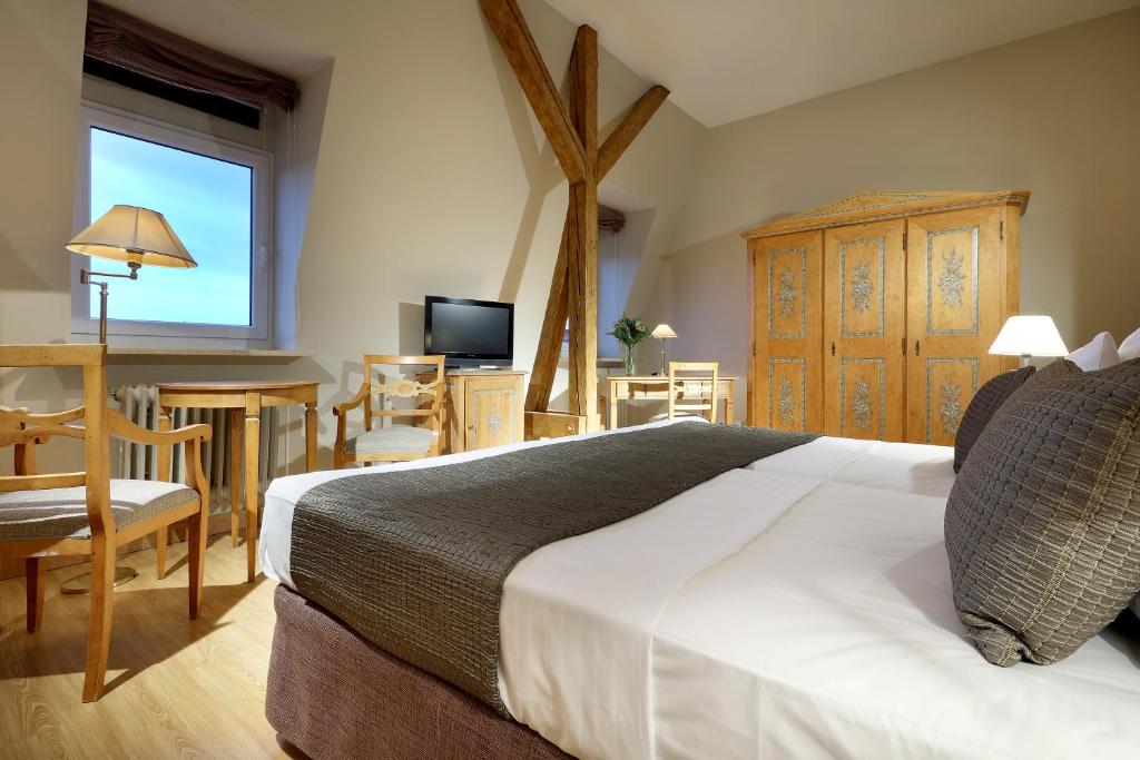 Postel nebo postele na pokoji v ubytování Eurostars Park Hotel Maximilian