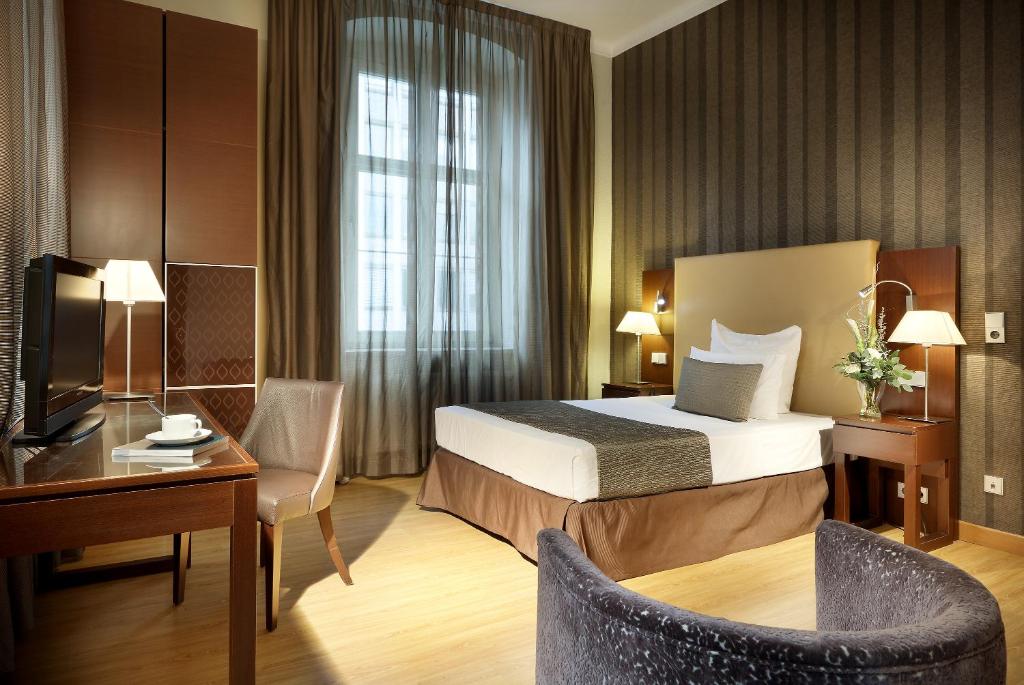Postel nebo postele na pokoji v ubytování Eurostars Park Hotel Maximilian