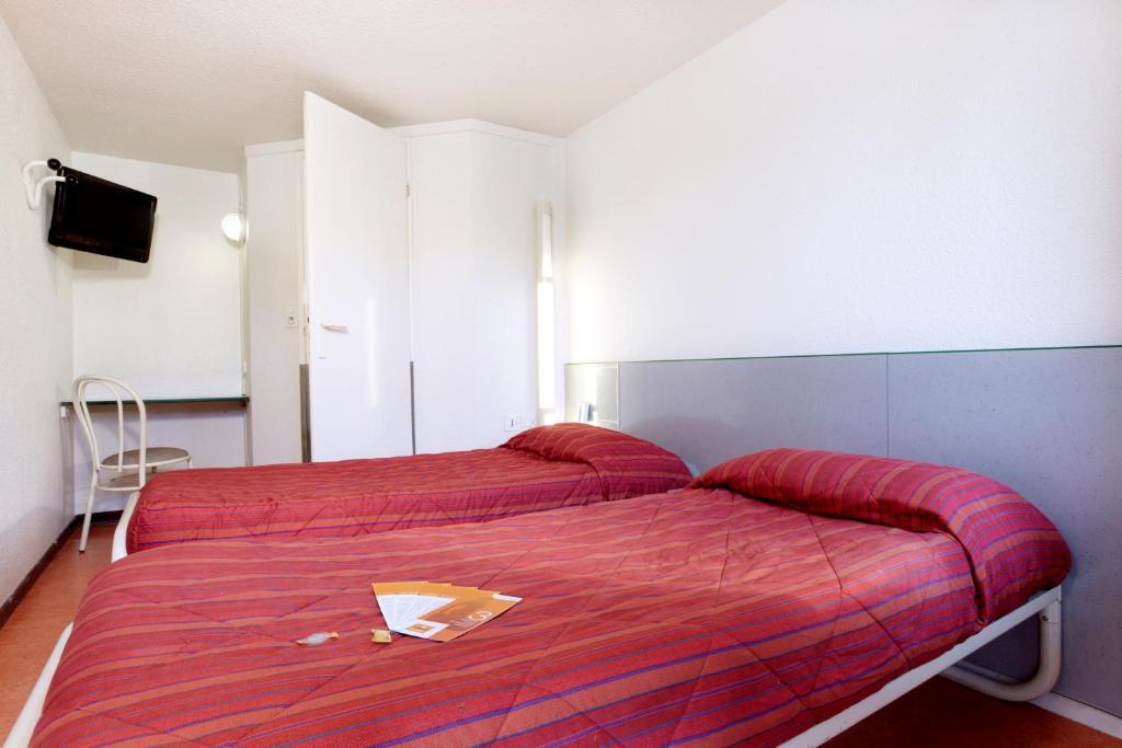 Postel nebo postele na pokoji v ubytování Hôtel Premiere Classe Pamiers