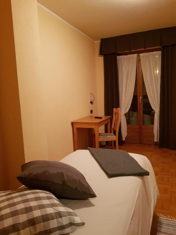 Postel nebo postele na pokoji v ubytování Hotel Cima Piazzi