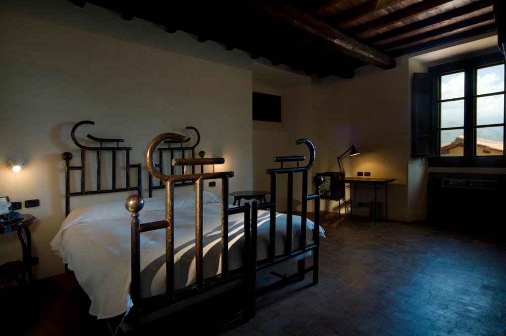 Postel nebo postele na pokoji v ubytování Foro Appio Mansio Hotel