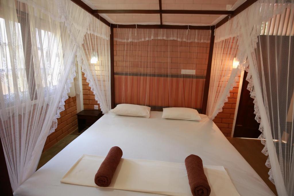 Postel nebo postele na pokoji v ubytování Eco Square Resort