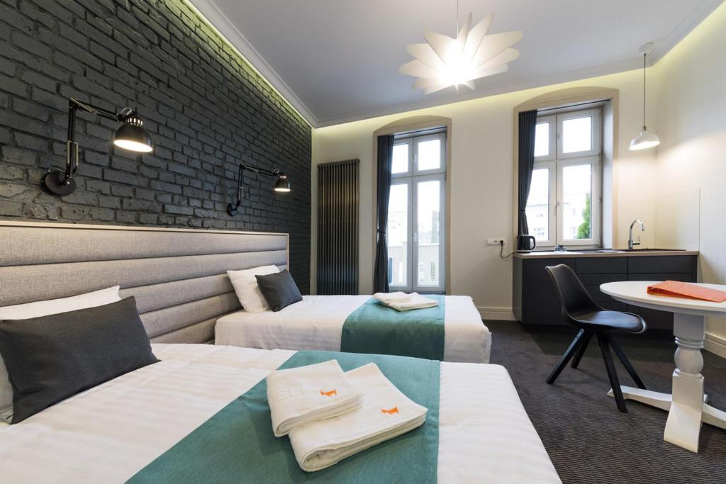 Posteľ alebo postele v izbe v ubytovaní Apartamenty Wodna 13