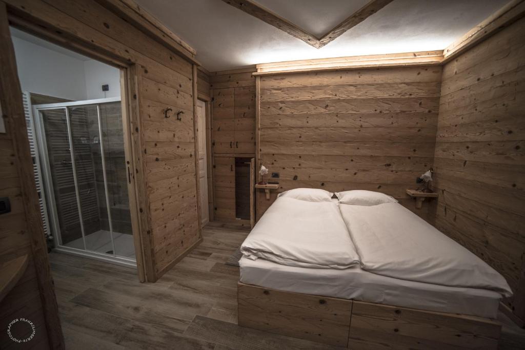 Letto o letti in una camera di B & B Le Riue